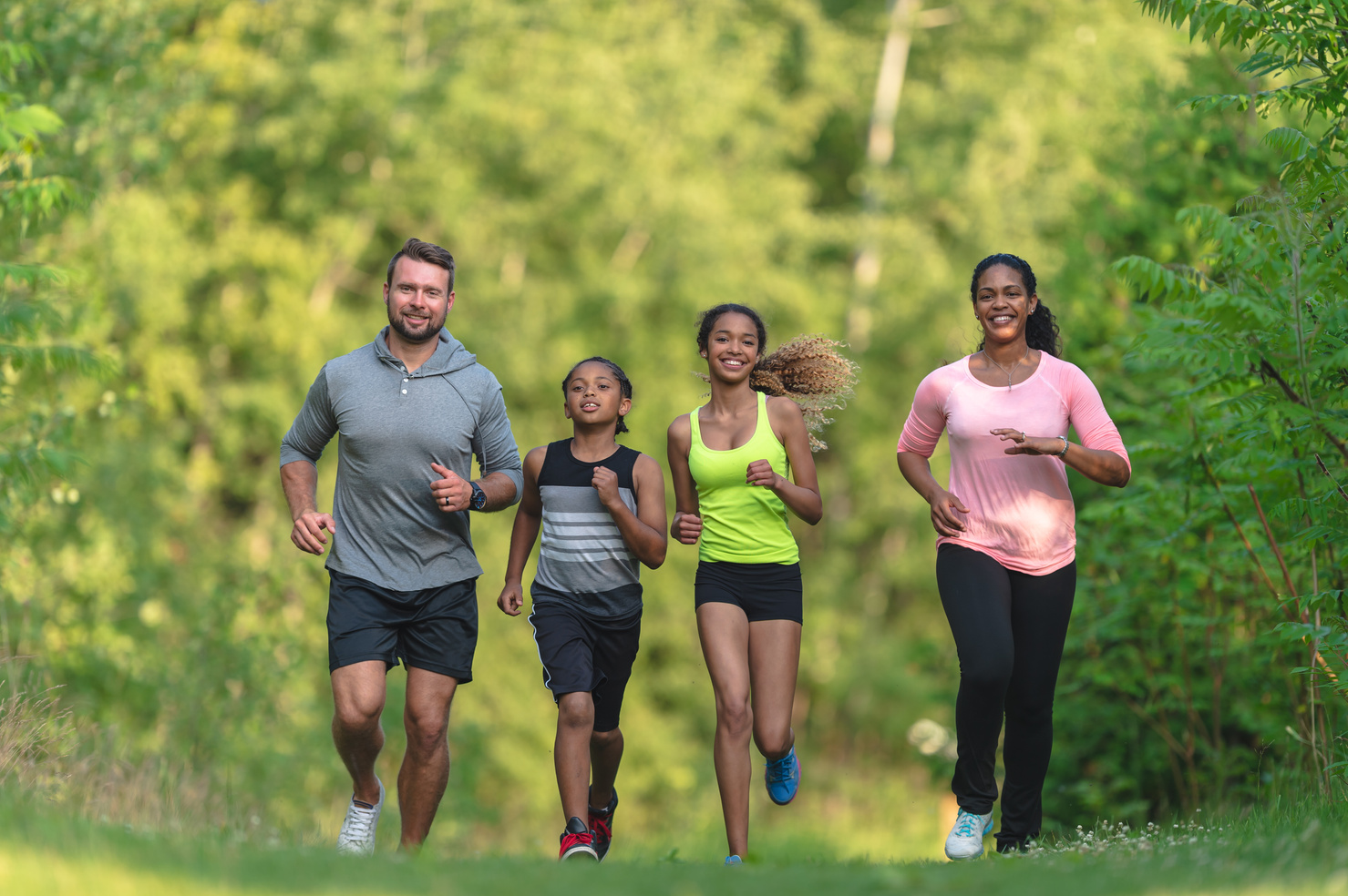 Family exercising together outdoors